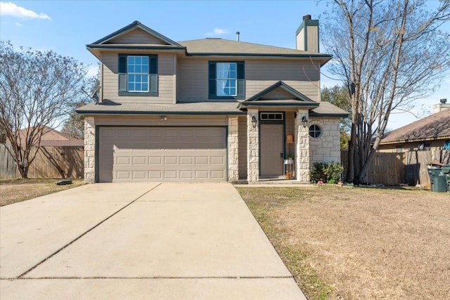 view of front of home featuring a garage and a front yard