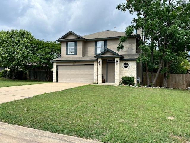 311 Juniper Dr, Georgetown, TX 78626 - traditional-style home featuring fence, an attached garage, concrete driveway, and a front lawn