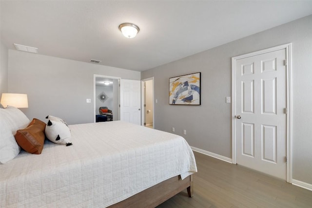 bedroom with wood-type flooring