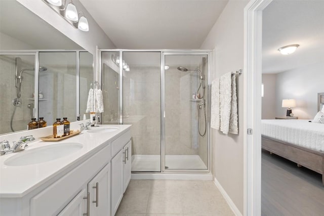 bathroom featuring vanity, tile patterned floors, and walk in shower