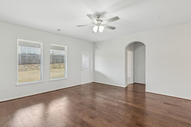 spare room featuring dark hardwood / wood-style floors and ceiling fan