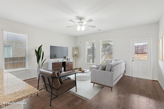 living room with dark hardwood / wood-style floors and ceiling fan