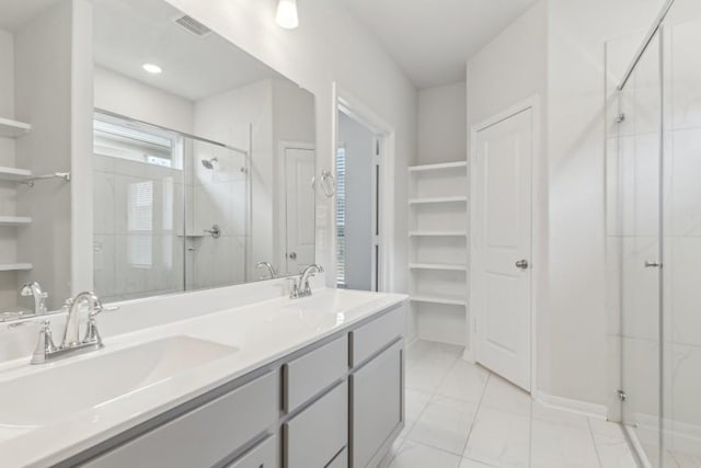 bathroom featuring vanity and an enclosed shower