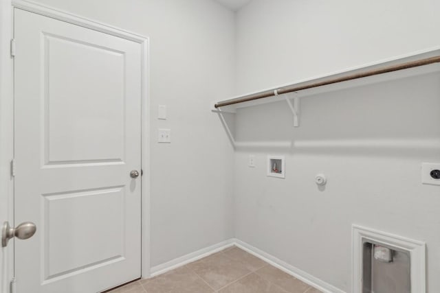 laundry room with gas dryer hookup, washer hookup, hookup for an electric dryer, and light tile patterned floors