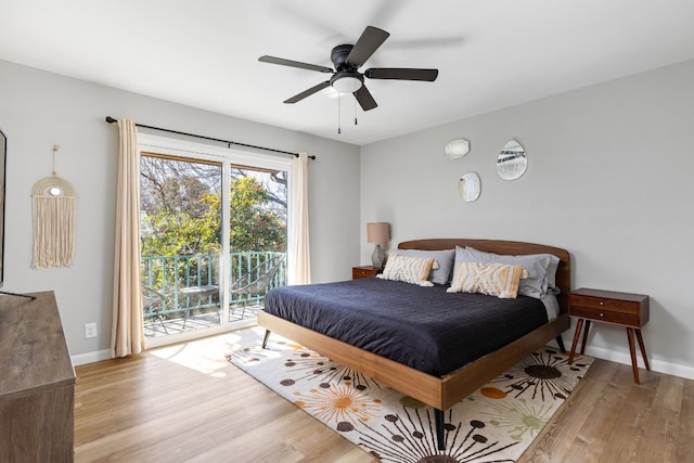 bedroom with light hardwood / wood-style flooring, access to outside, and ceiling fan