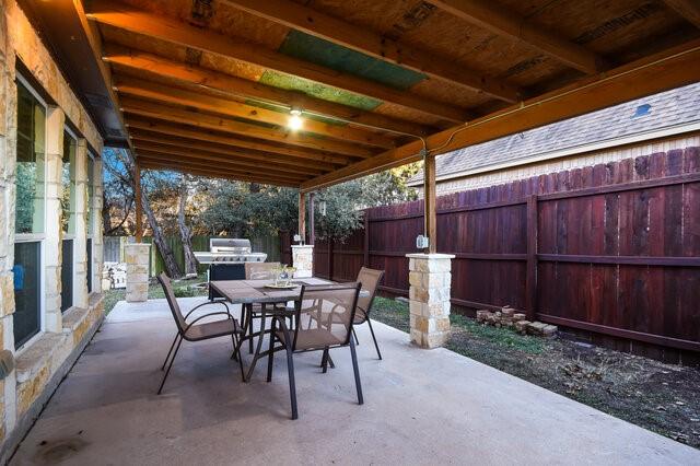 view of patio with a grill