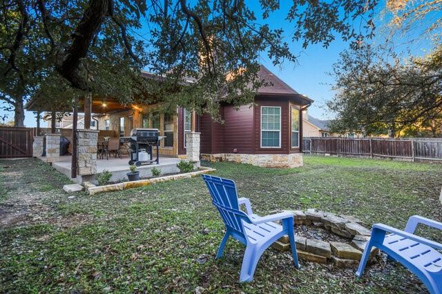 view of yard featuring a patio area and a fire pit