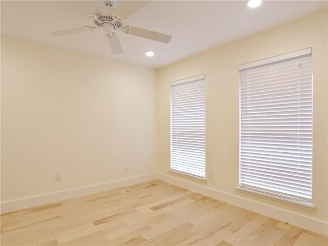 empty room featuring light hardwood / wood-style flooring and ceiling fan