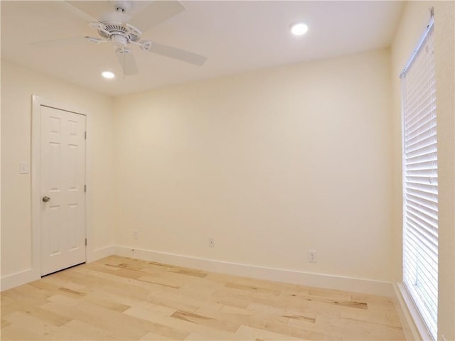 unfurnished room featuring ceiling fan and light wood-type flooring