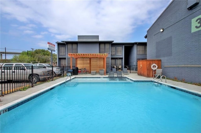 view of swimming pool with a pergola