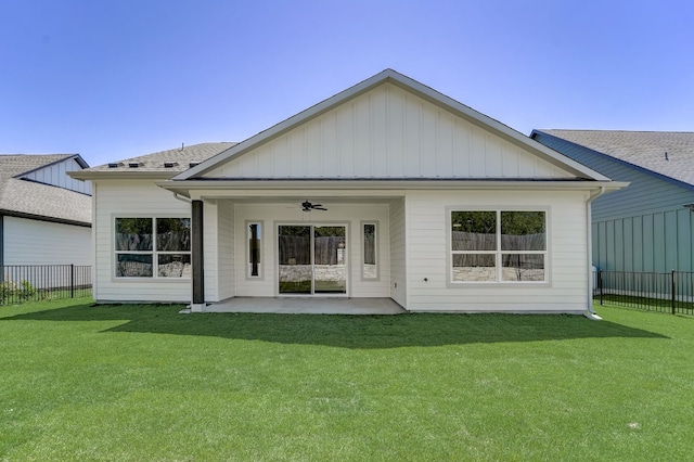 back of property with a patio, a yard, and ceiling fan