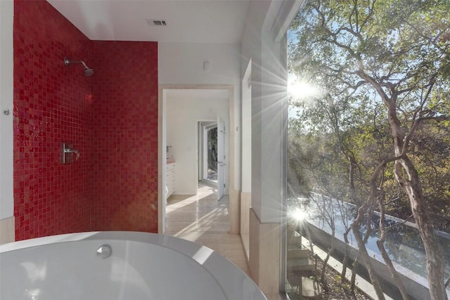 bathroom featuring a washtub