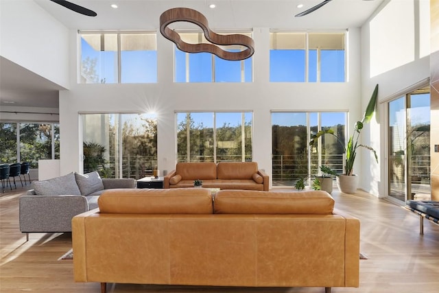 sunroom featuring a healthy amount of sunlight and ceiling fan