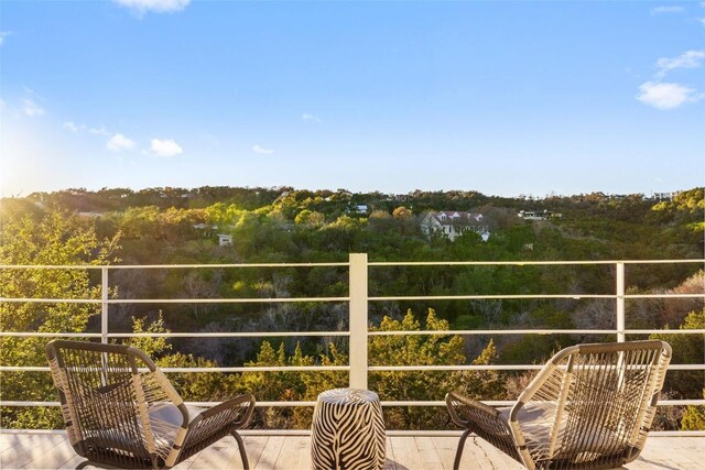 2102 N Oak Canyon Rd, Austin, TX 78746 - balcony featuring a view of trees