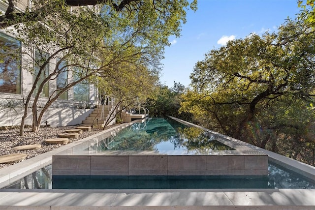 2102 N Oak Canyon Rd, Austin, TX 78746 - swimming pool featuring stairs
