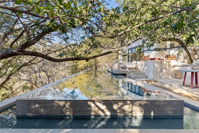 2102 N Oak Canyon Rd, Austin, TX 78746 - rear view of house with stairway