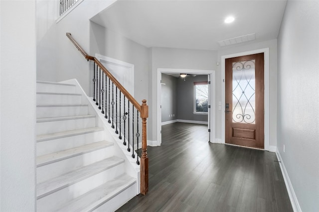 entrance foyer with dark hardwood / wood-style flooring