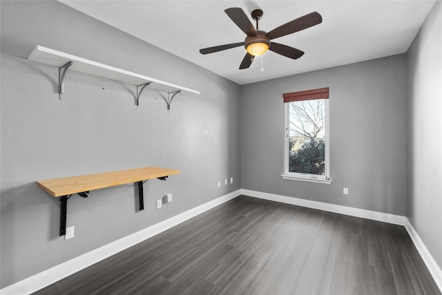 unfurnished room featuring ceiling fan and dark hardwood / wood-style flooring