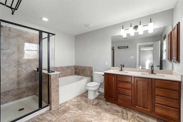 full bathroom featuring toilet, vanity, and shower with separate bathtub