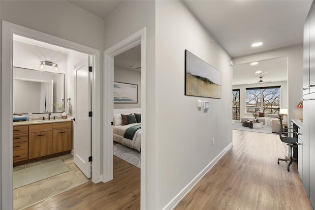 hallway with light wood-type flooring