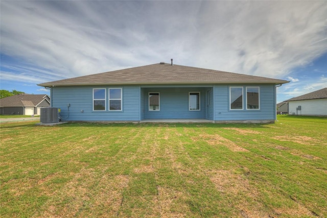 650 Radley Rd, Lockhart, TX 78644 - back of property featuring a lawn and central air condition unit