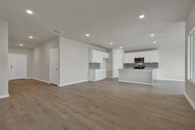 650 Radley Rd, Lockhart, TX 78644 - unfurnished living room with light hardwood / wood-style flooring