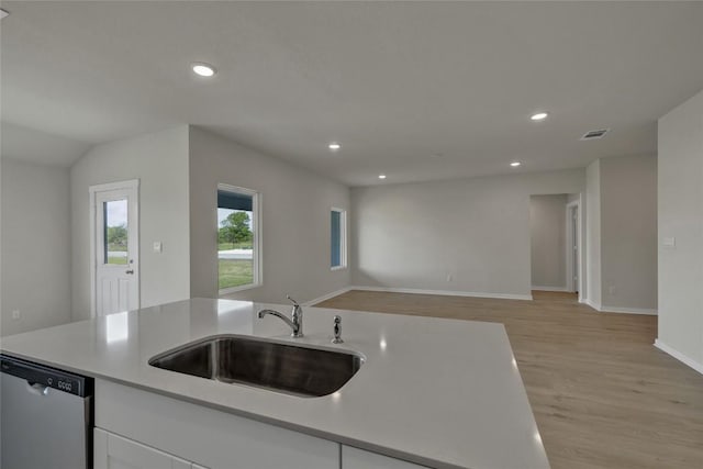 650 Radley Rd, Lockhart, TX 78644 - kitchen with dishwasher, sink, and light wood-type flooring