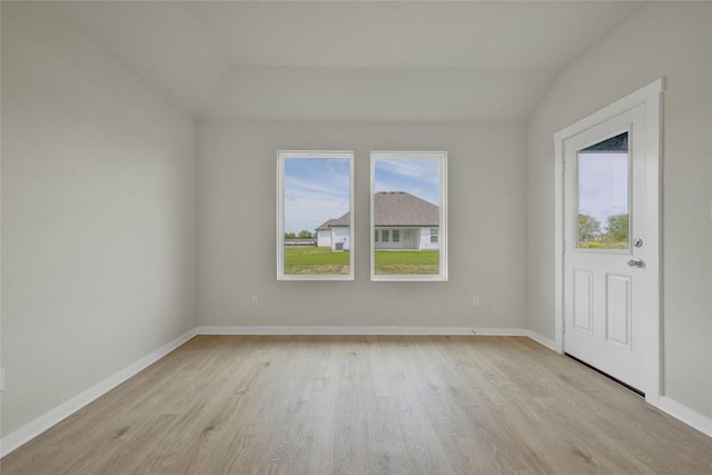 650 Radley Rd, Lockhart, TX 78644 - spare room with lofted ceiling and light wood-type flooring