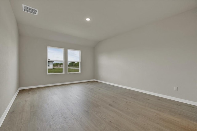 650 Radley Rd, Lockhart, TX 78644 - spare room featuring vaulted ceiling and light wood-type flooring