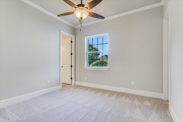 empty room with light carpet, crown molding, and ceiling fan