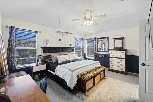 bedroom featuring light colored carpet and ceiling fan