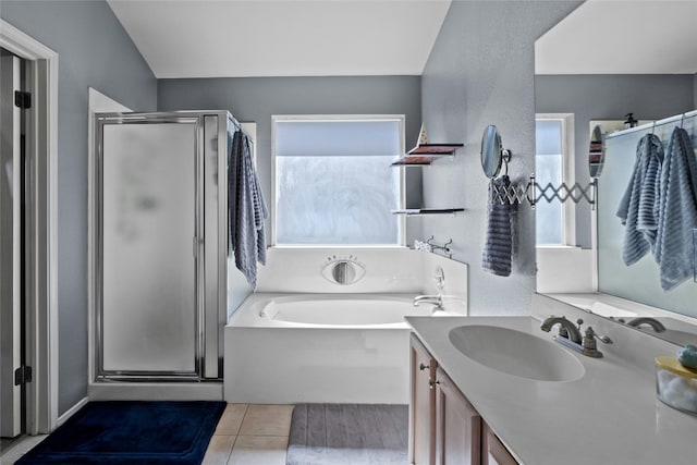 bathroom featuring vanity, separate shower and tub, and tile patterned flooring