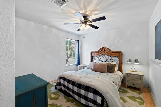 bedroom featuring ceiling fan and wood-type flooring