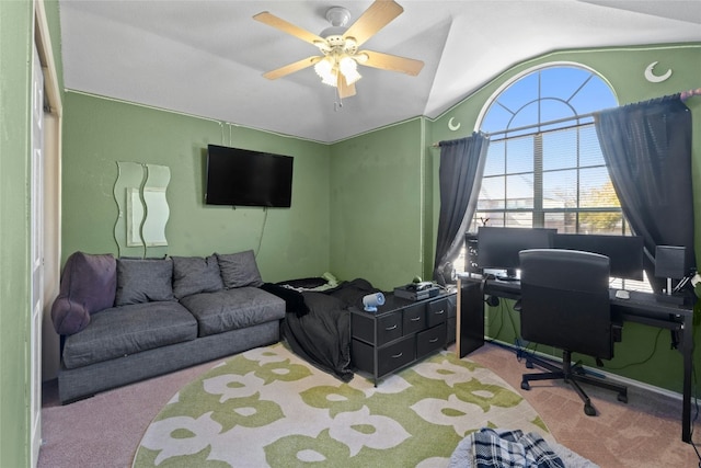 office with vaulted ceiling, light colored carpet, and ceiling fan