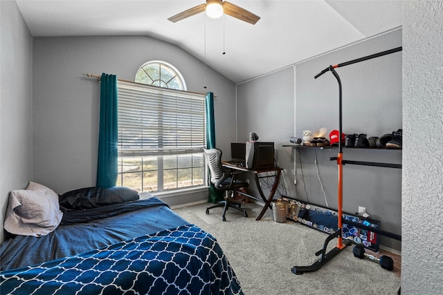 carpeted bedroom featuring lofted ceiling and ceiling fan