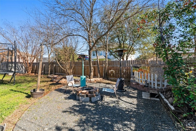 view of yard with an outdoor fire pit