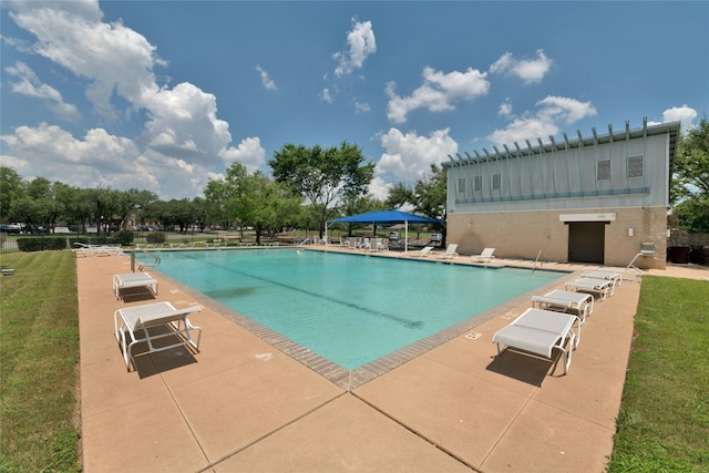 view of swimming pool featuring a patio area