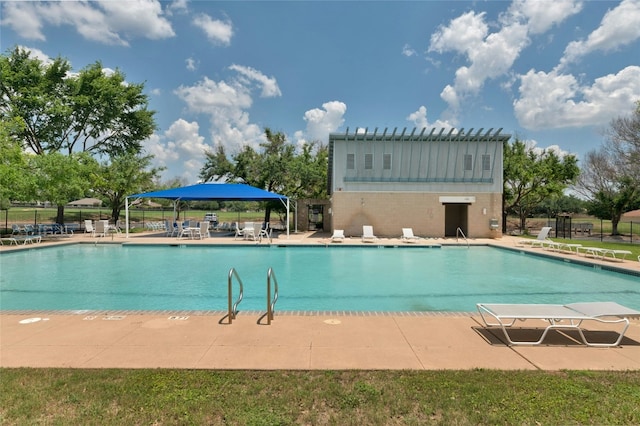 view of swimming pool with a patio