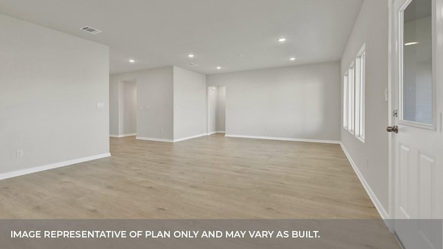 unfurnished room with light hardwood / wood-style flooring