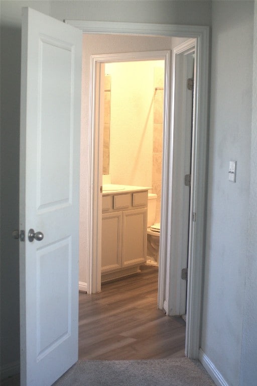 corridor featuring hardwood / wood-style flooring