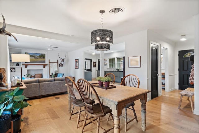 1802 Hutto Rd, Georgetown, TX 78626 - dining area with a chandelier and light wood-style floors