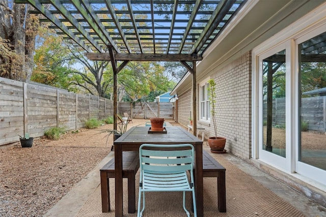 view of patio / terrace with outdoor dining space, a fenced backyard, and a pergola