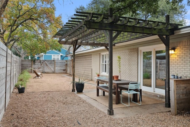 view of patio with a fenced backyard, a gate, and a pergola