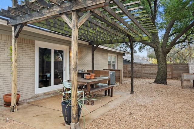 view of patio with fence and a pergola