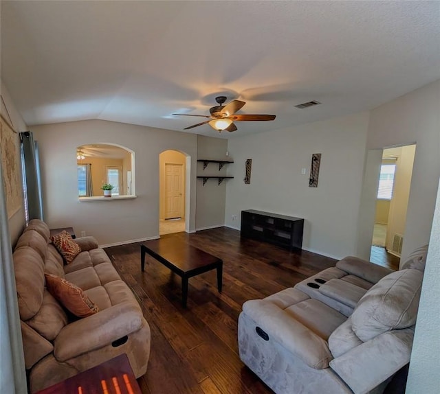 living room featuring dark wood-type flooring, ceiling fan, and lofted ceiling