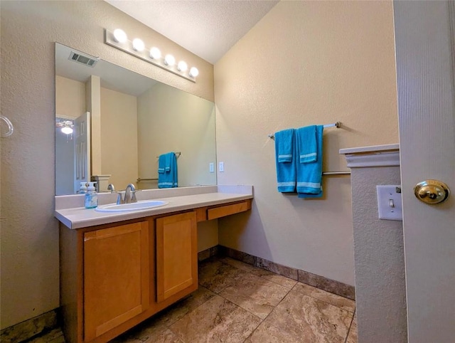 bathroom featuring vanity and a textured ceiling