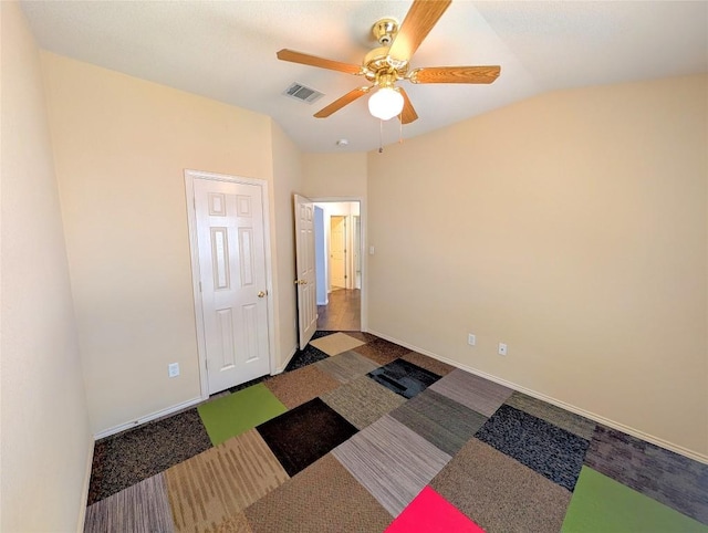 unfurnished room with lofted ceiling and ceiling fan