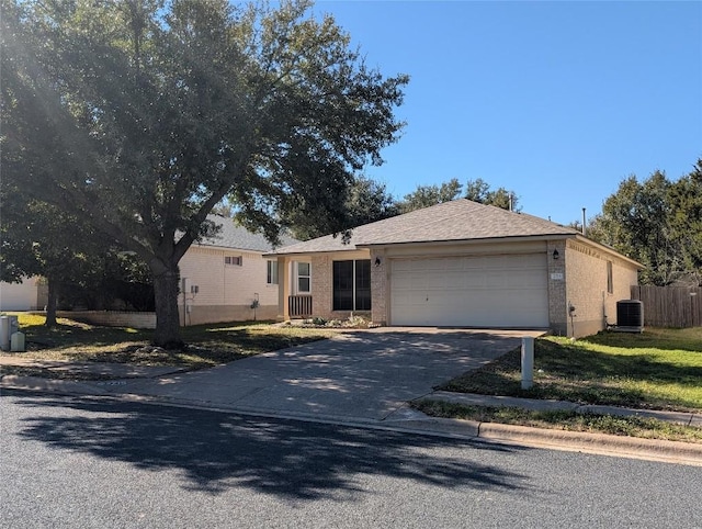 ranch-style house with a garage and central AC