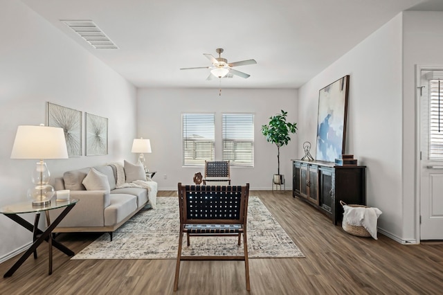 living room featuring hardwood / wood-style flooring and ceiling fan