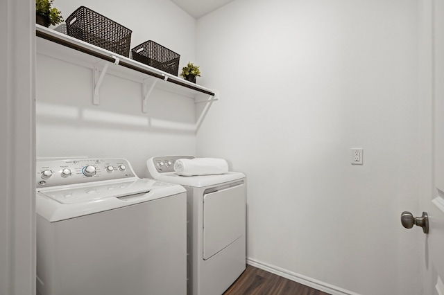 washroom featuring dark hardwood / wood-style flooring and washer and dryer